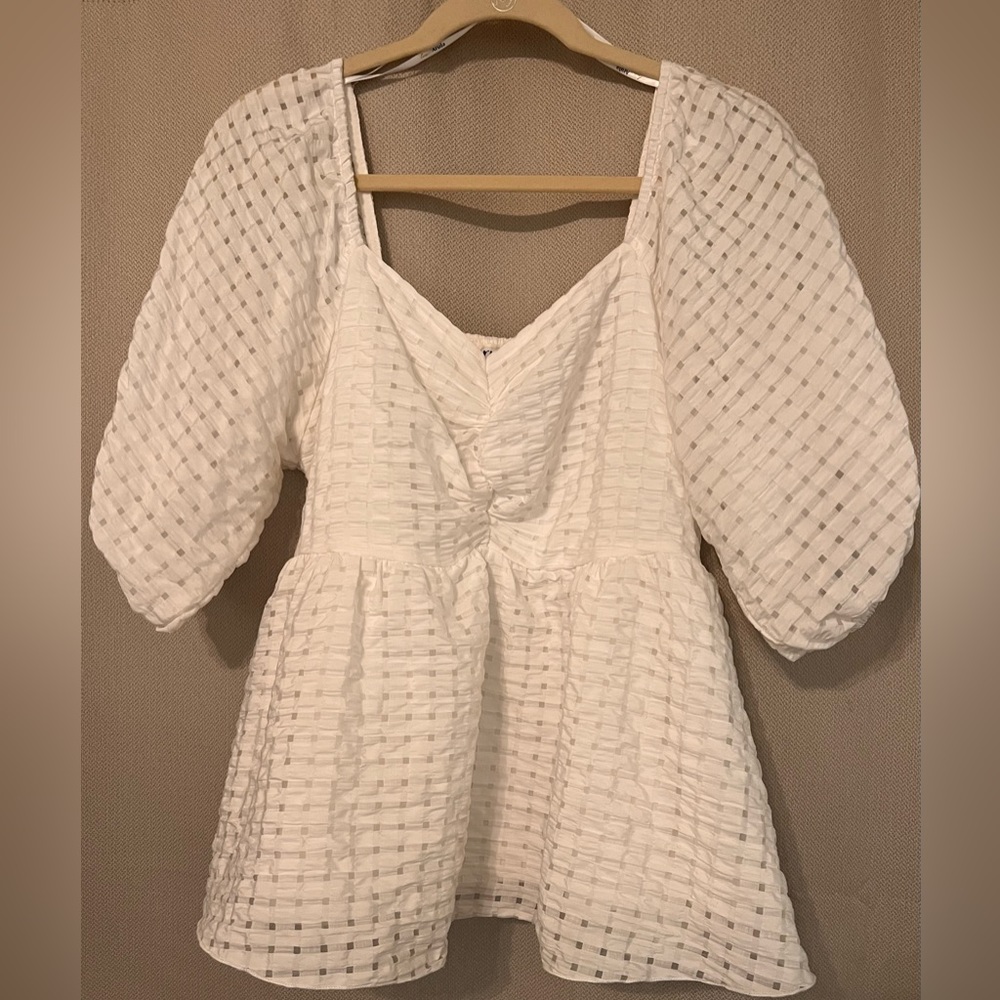 White peplum style top